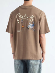 Men's graphic tee in Desert Color with a fishing scene and text print.