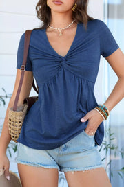 Blue polyester short-sleeve blouse with V-neck and twist knot detail