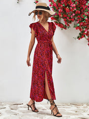 Emerald floral wrap midi dress in deep red with flutter sleeves and a belted waist.