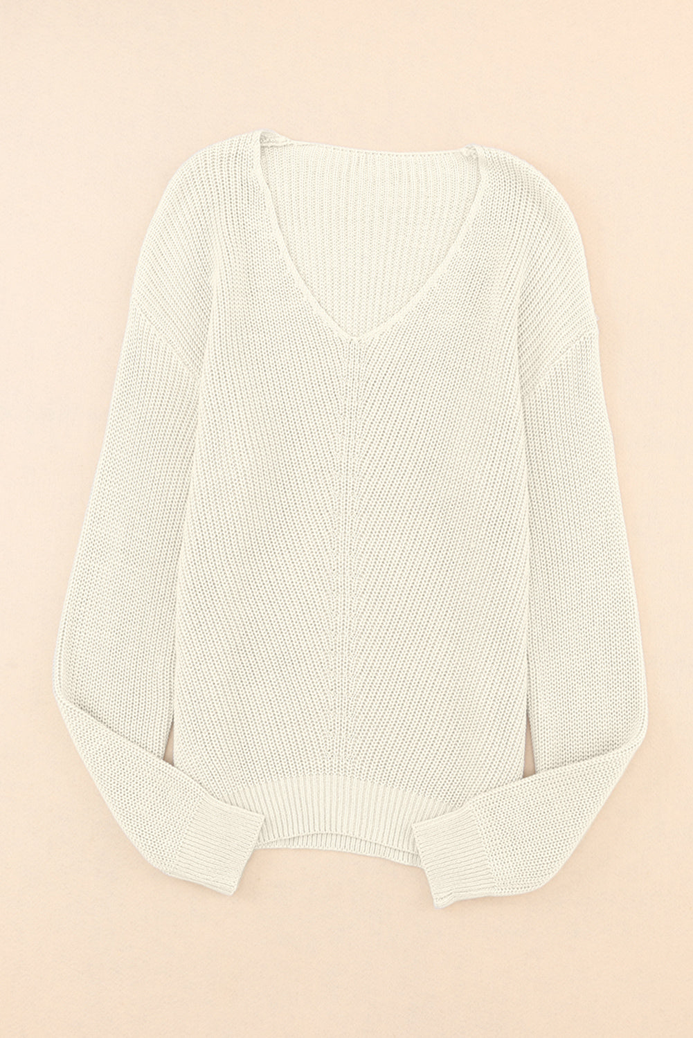 Relaxed knit V-neck pullover sweater in beige with a subtle chevron stitch detail.