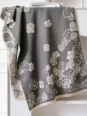 Gray scarf with an elegant floral rose pattern and diamond texture.