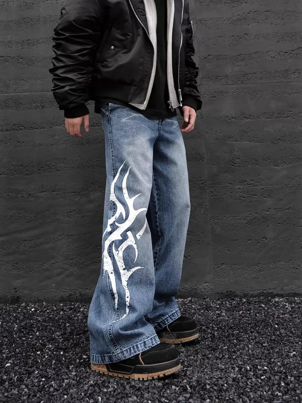 Men's blue denim wide leg jeans with tribal print detail