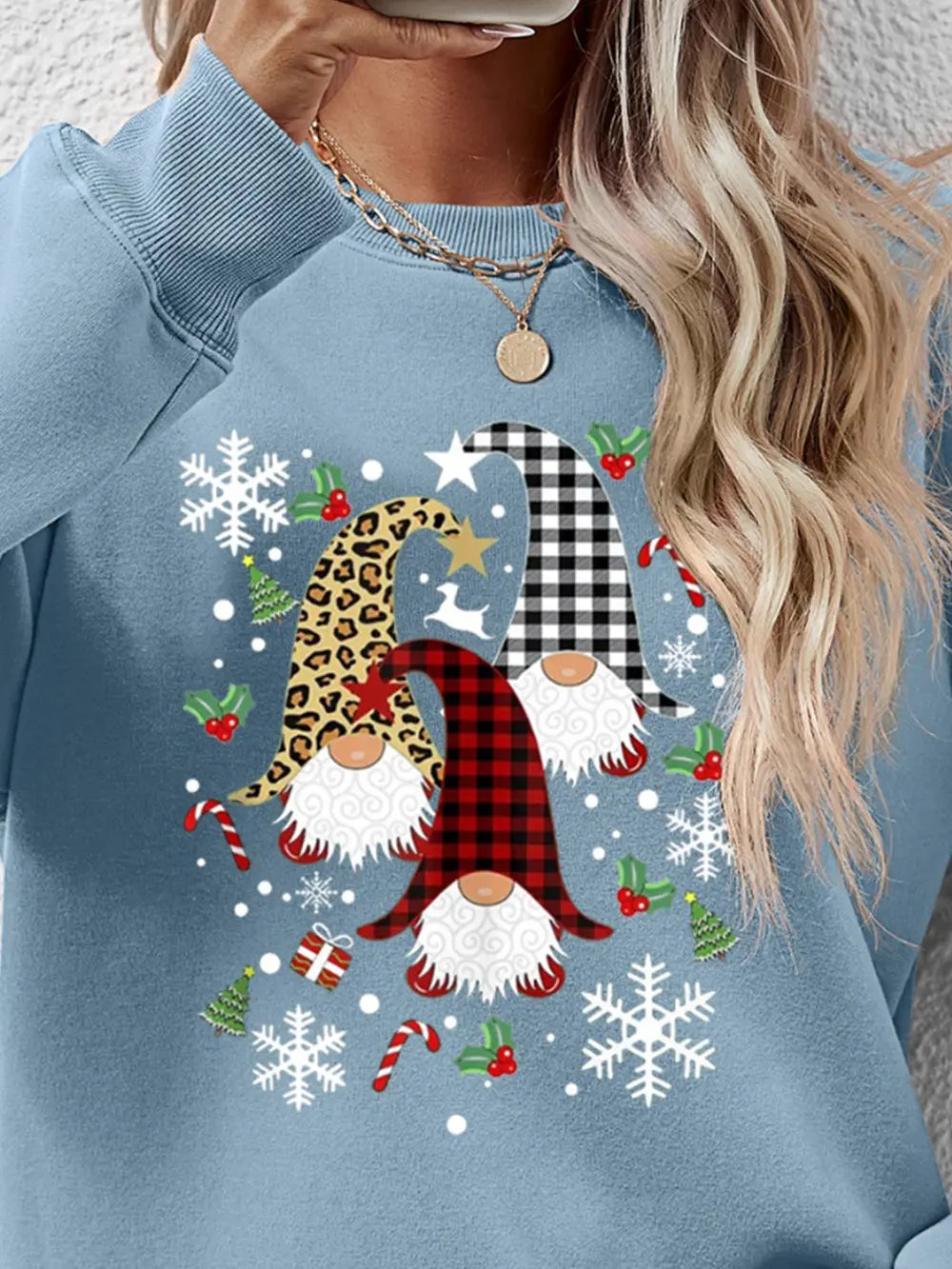 Festive gnome graphic raglan sweatshirt in Misty Blue with holiday icons.