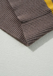 Brown knit sweater with yellow stripe detail