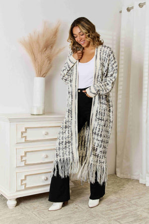 Black/White chromatic crochet maxi cardigan with fringe detail and boho styling.