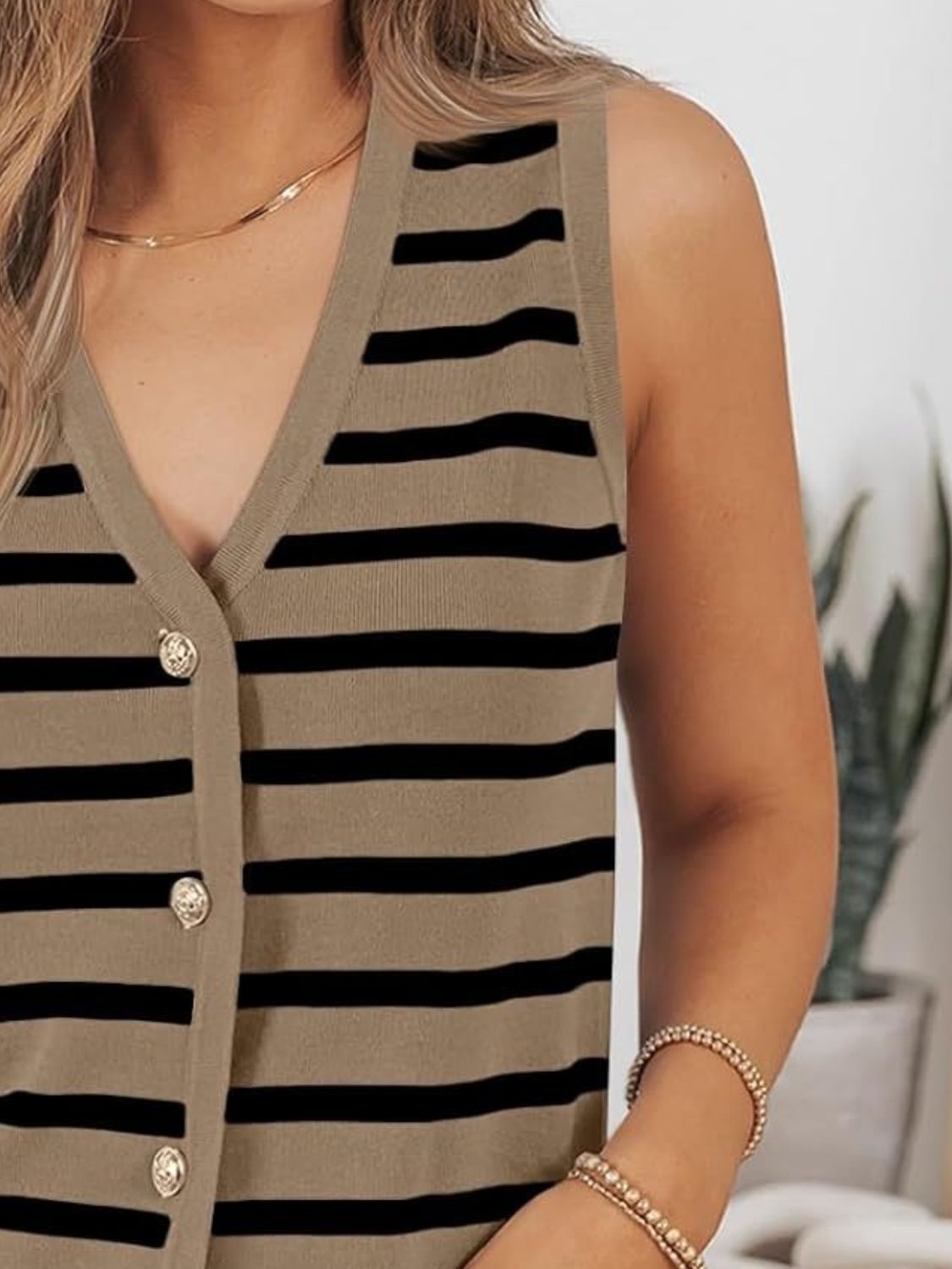 Button-front knit top in tan with black Breton stripes, V-neck, sleeveless.