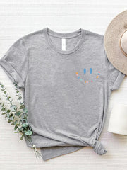 Gray crew neck t-shirt with a colorful smiley face graphic that says Be Kind To Your Mind