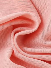 Pink cotton knit fabric with a subtle textured pattern.