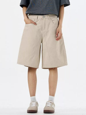 Light khaki chino shorts with drawstring waist and wide leg.