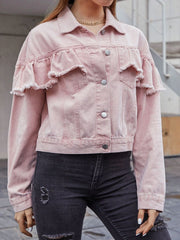 Blush pink denim trucker jacket with frayed ruffle details on the shoulders and sleeves.