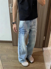 Men's light wash distressed wide leg jeans with vintage look.