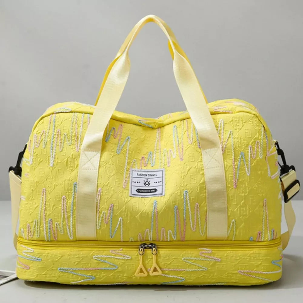 Yellow textured Oxford duffel bag with colorful wave pattern and dual compartments.