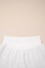 White ribbed-waist high rise relaxed shorts with a gathered fabric detail.