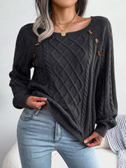 Charcoal cable-knit sweater with buttoned shoulder detail and crew neckline.
