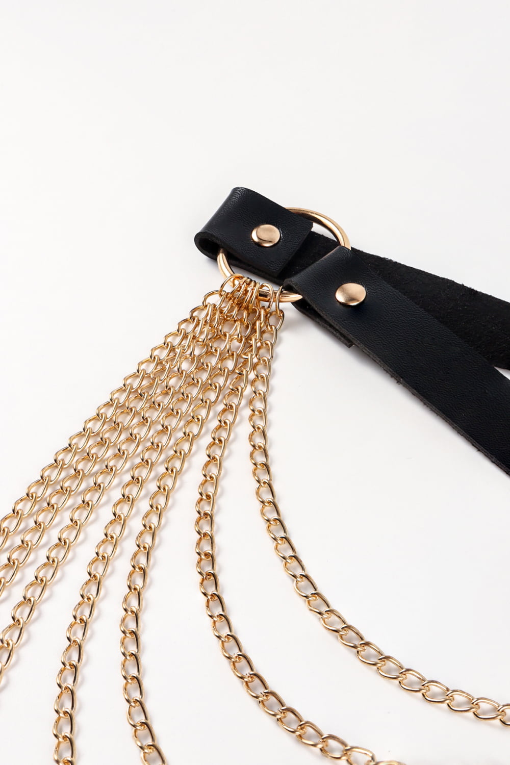 Black leather waist harness with cascading gold chains and gold hardware.