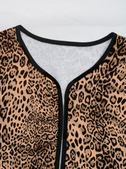 Leopard print boxy jacket with black edge trim and V-neckline.