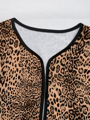 Leopard print boxy jacket with black edge trim and V-neckline.