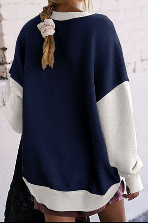 Crewneck sweatshirt with contrast navy and white colorblock design.