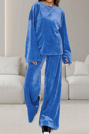 Blue velvet loungewear set with wide sleeve top and relaxed fit pants.