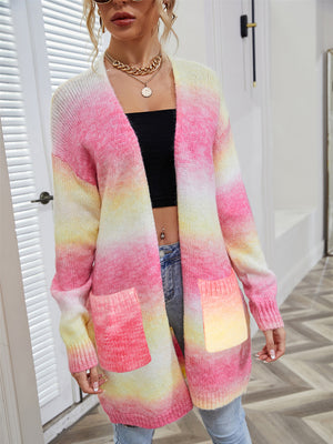 Rainbow gradient knit cardigan with pockets, open front, long sleeves, and a relaxed fit.