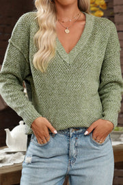 Matcha green open-knit slouchy V-neck sweater with long sleeves and a relaxed fit.