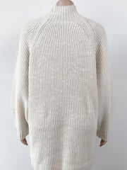 Cream ribbed knit cocoon turtleneck dress with long sleeves and a relaxed fit.