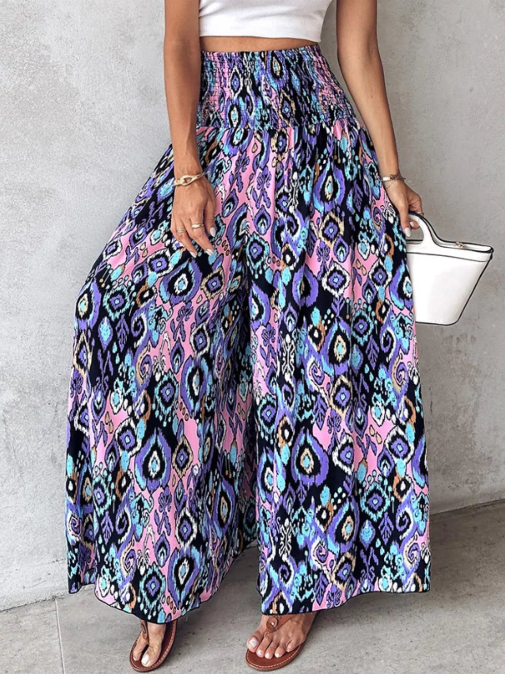Bohemian print wide-leg pants with smocked waist in purple, pink, and blue
