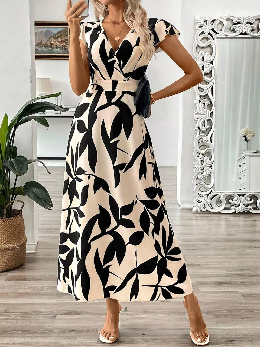 Floral print midi dress with cap sleeves and a wrap neckline in black and apricot.