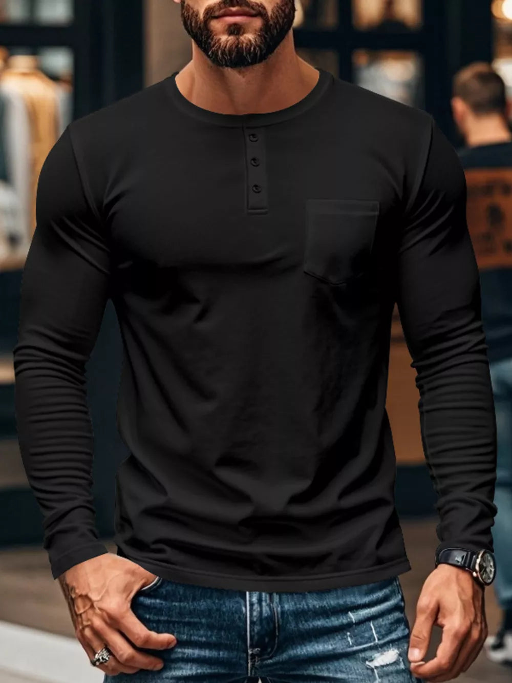 Black long sleeve henley t-shirt with button placket and chest pocket.