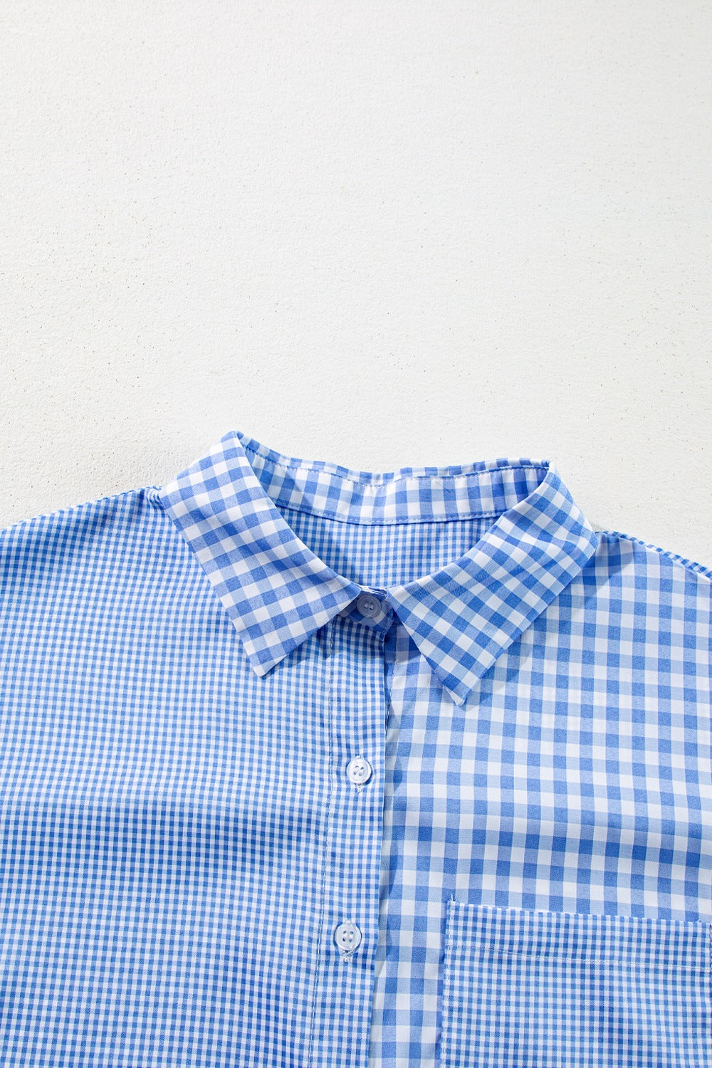 Light blue gingham oversized shirt with patch pocket and button front.