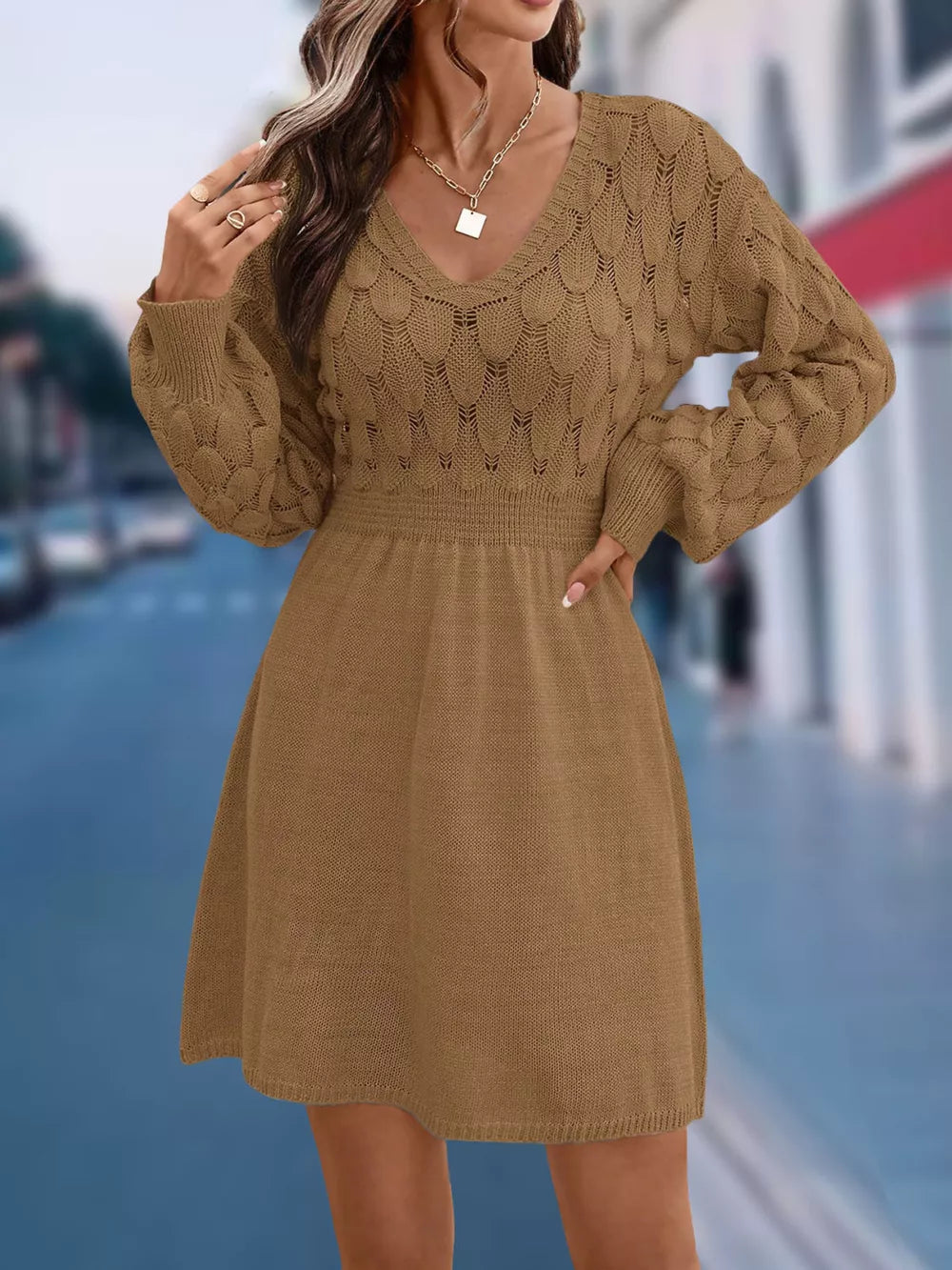 Tan openwork knit V-neck sweater dress with cinched waist and above knee length