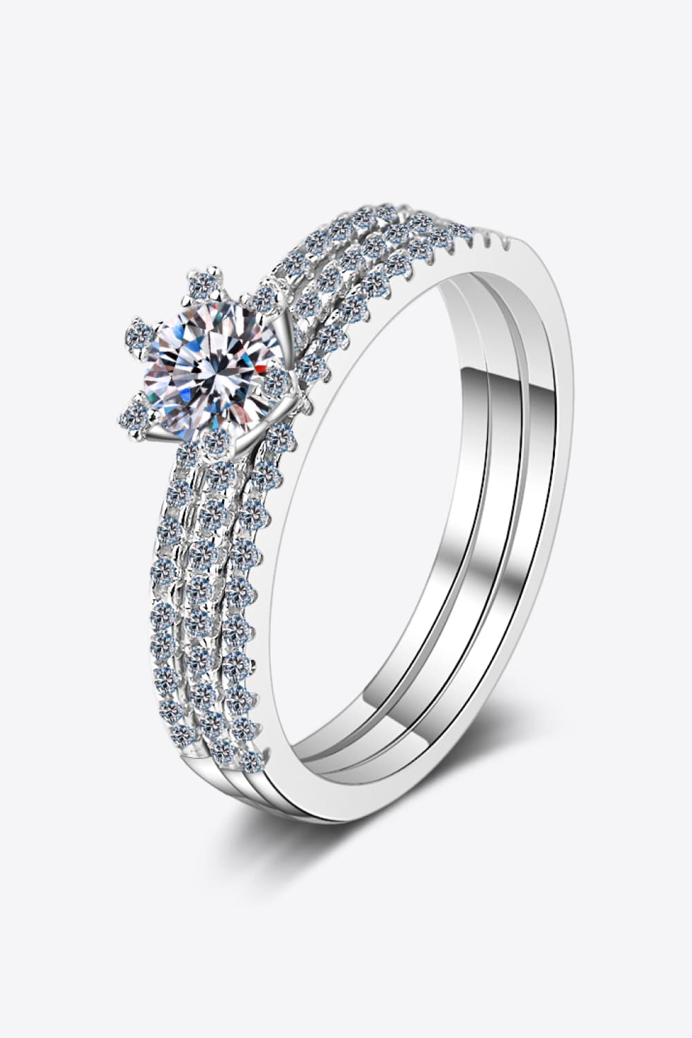 Silver ring trio with a central diamond and pave band accents