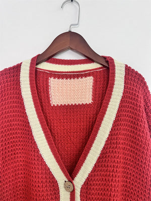 Scarlet textured knit cardigan with cream varsity stripes and a single button closure.