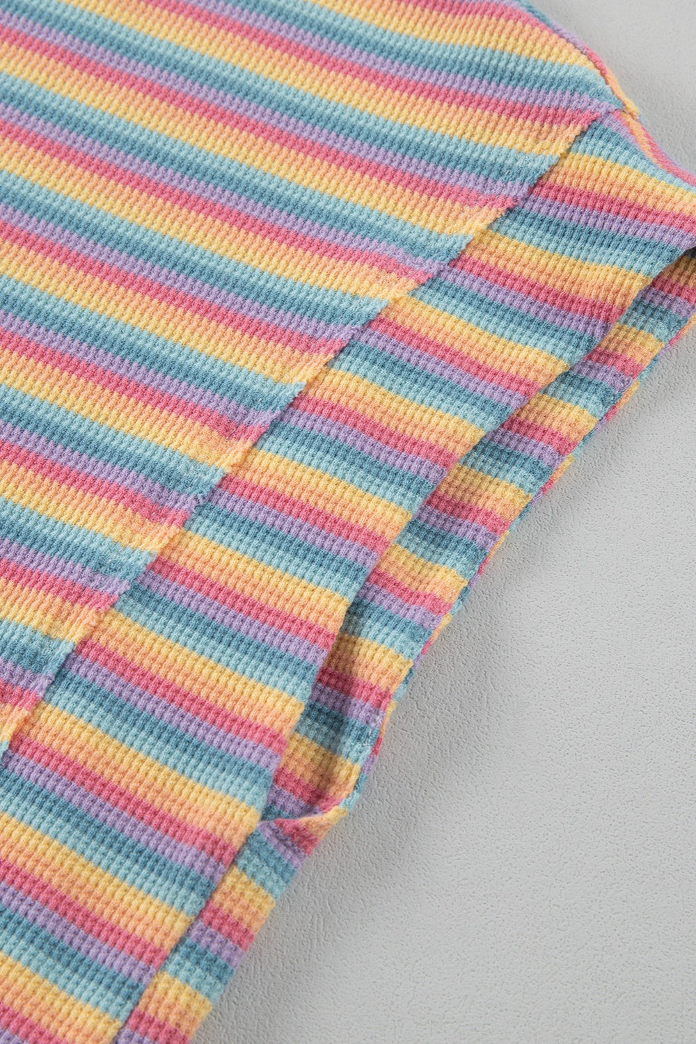 Rainbow stripe cotton lounge set detail with waffle knit texture.