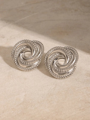 Silver swirl knot stud earrings with beaded edge detail