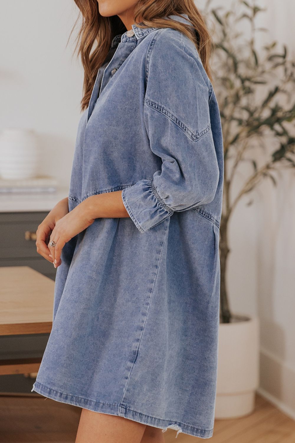 Light blue denim shirtdress with A-line cut and ruffled cuff detail
