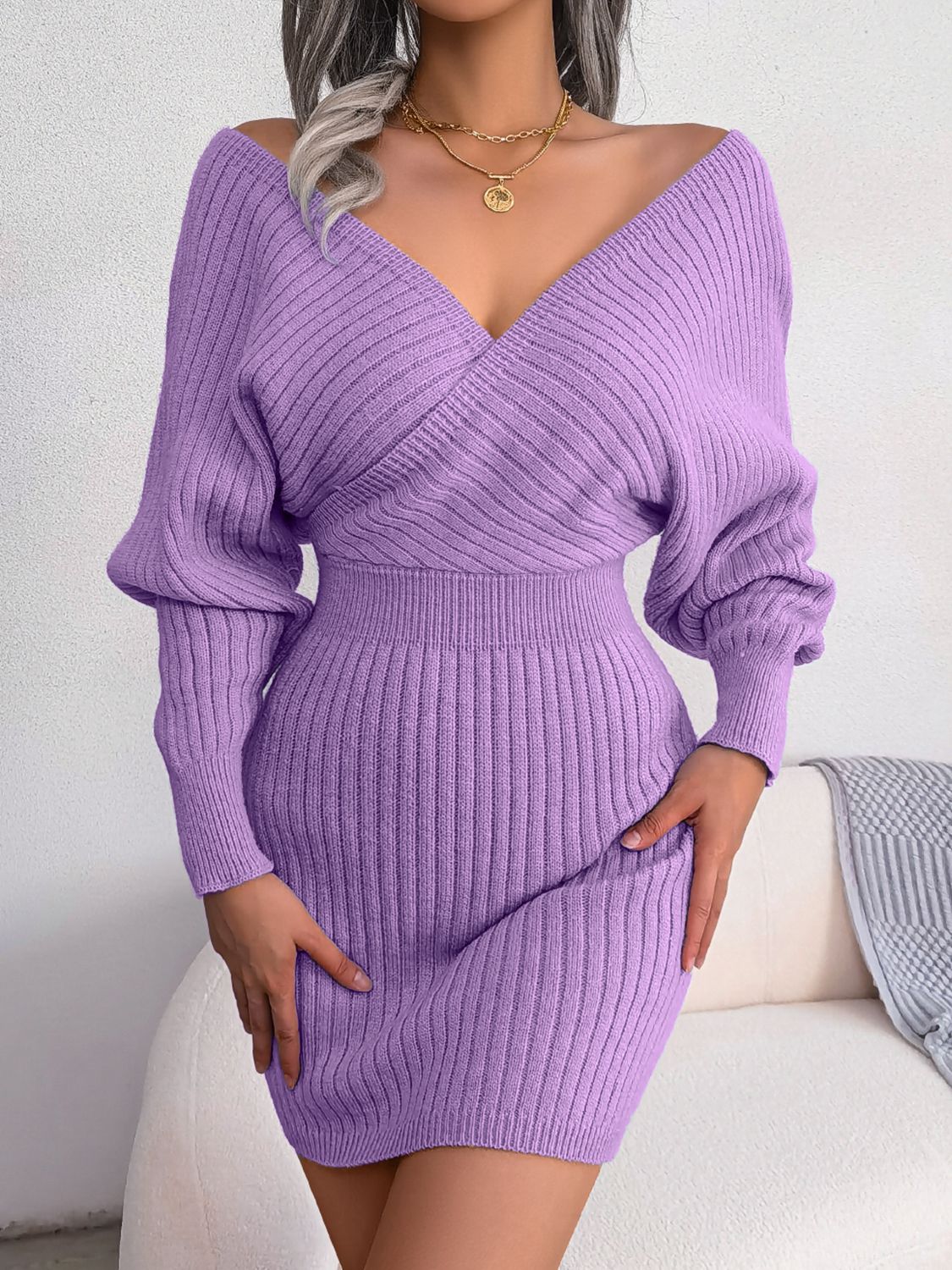 Wrap knit bodycon mini dress in heliotrope purple with a deep V-neck and long balloon sleeves.