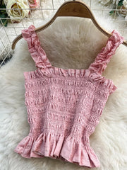 Pink eyelet crop top with ruffled straps and hem