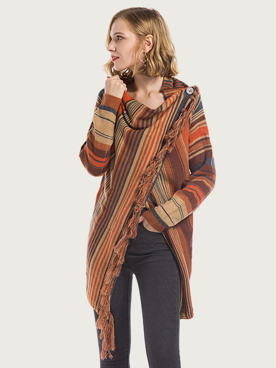 Asymmetric fringe stripe cardigan in ochre with cowl neck and button detail.