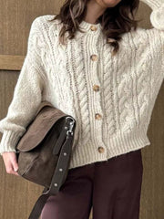 Ivory cable-knit button-down cardigan with wooden buttons.