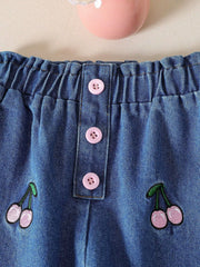 Baby denim set with cherry embroidery and pink button details.