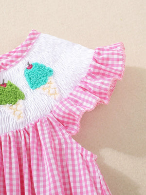 Baby one-piece with pink gingham, smocked white bodice with embroidered ice cream cones and ruffled sleeves.