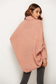 Textured cocoon knit cardigan in blush pink with batwing sleeves and a cowl neck.