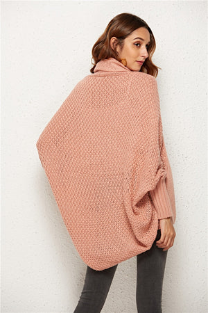 Textured cocoon knit cardigan in blush pink with batwing sleeves and a cowl neck.