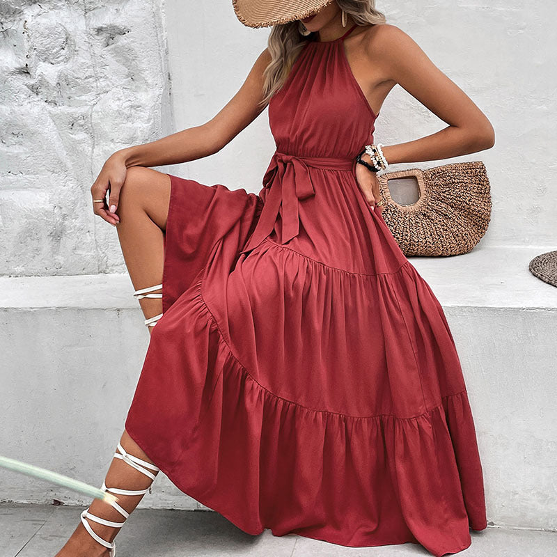 Burgundy halter neck tiered midi dress with belted waist and ruffle hem.