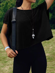 Black t-shirt with exposed seams and cutout back detail.