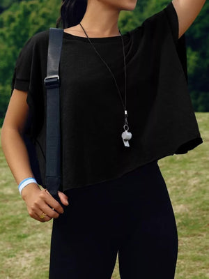 Black t-shirt with exposed seams and cutout back detail.