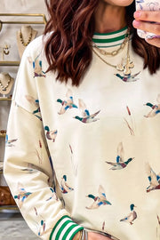 Whimsical Duck Print Sweatshirt in Beige, close-up detail