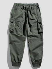 Army green cargo joggers with flap pockets and elastic cuffs.