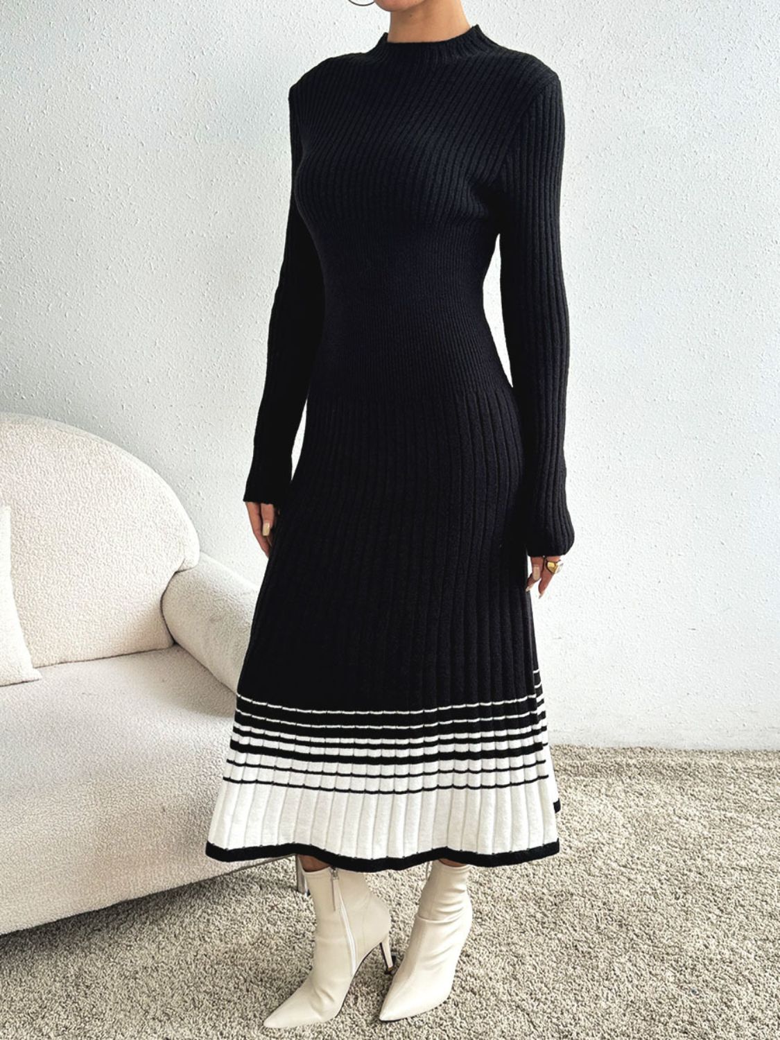 Black ribbed knit midi dress with contrast striped hem and mock neck